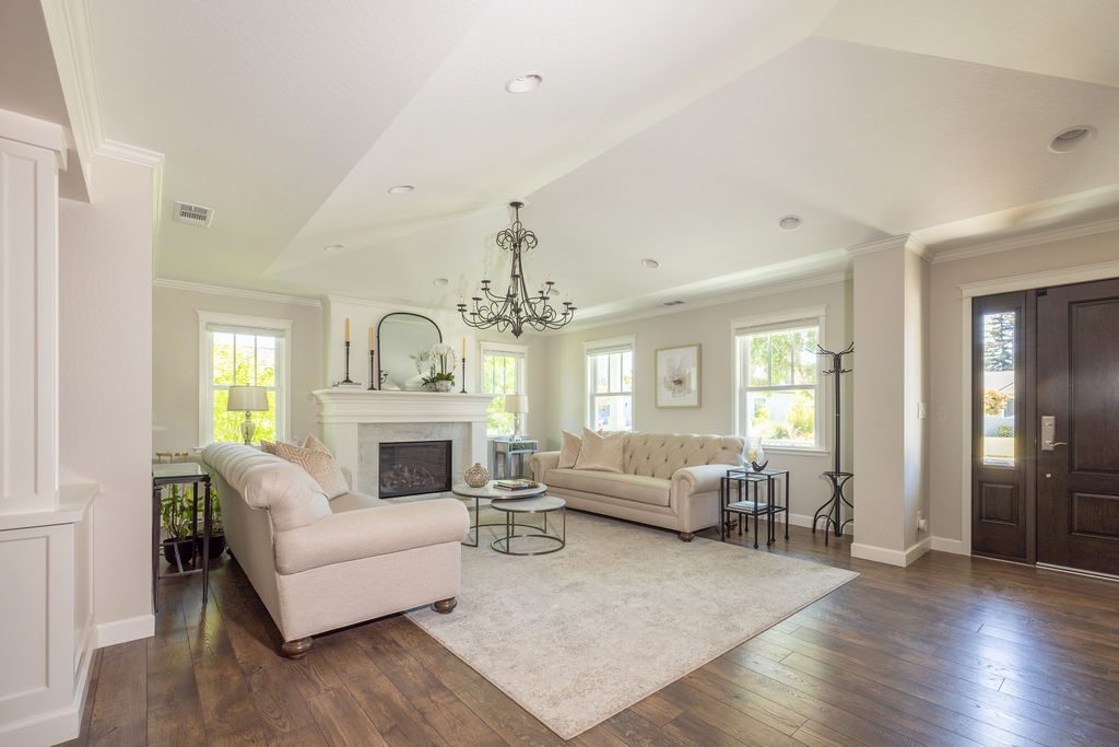Bright, open living room designed as part of a whole house remodel checklist, blending comfort with modern finishes.